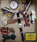 A quantity of toy cars, novelty watches and a Mickey Mouse stopwatch