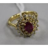 A yellow metal, ruby and diamond cluster ring, size K.