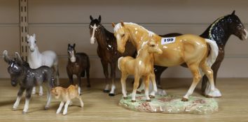 A collection of Beswick horses and donkey's
