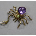 A yellow metal, amethyst and peridot set spider pendant, 25mm.