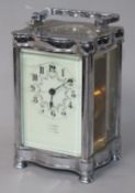 A silver-plated carriage timepiece, of serpentine form, retailed by G. Dimmer, Southsea, having