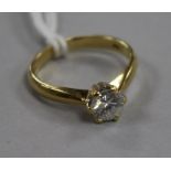 An 18ct gold and solitaire diamond ring, size K.