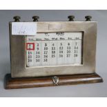 An engine turned silver mounted desk calendar with Gurkha crest.