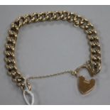 A 9ct gold curb link bracelet with heart shaped clasp, 16.3 grams.