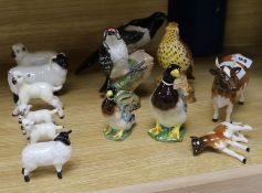 A collection of Beswick sheep, cows, ducks and birds