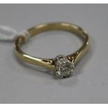 A modern 9ct gold and collet set solitaire diamond ring, size V.