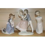 A Lladro figure group, 'Precious Love', another of a girl with basket and dog and a Zaphir figure of