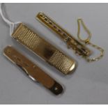 Two 9ct gold tie clips and a 9ct gold mounted penknife.