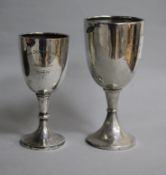 Two small silver presentation trophy cups, tallest 14.4cm.