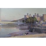 Julius Hare (1859-1952) two oils on canvas, Caernarfon Castle and Coastal scene, signed 22 x 35cm.