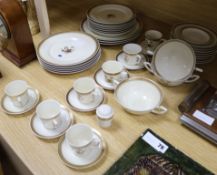 A Royal Copenhagen gilt decorated part dinner service