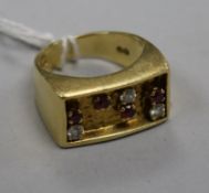 An early 1970's 18ct gold, ruby and diamond set ring, indistinct maker's mark, size K.