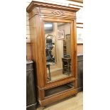 A mirrored door cupboard W.112cm