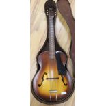 A Silverstone Sunburst cello guitar, cased 104cm