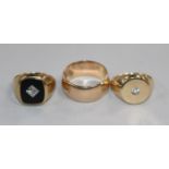Three assorted 9ct gold rings, including black onyx.