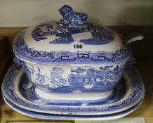 A blue and white tureen, a ladle and two meat dishes