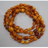 A single strand graduated amber bead necklace, gross weight 72 grams, 128cm.