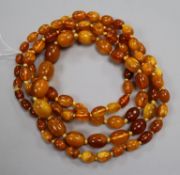 A single strand graduated amber bead necklace, gross weight 72 grams, 128cm.