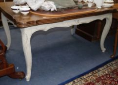 A painted French Louis XV draw leaf dining table W.150cm