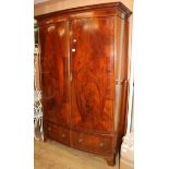 A George III style banded mahogany two door bowfronted wardrobe W.138cm