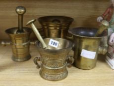 Four bronze mortars and pestles tallest 14cm