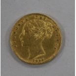 An 1853 gold full sovereign.