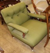 A Victorian low mahogany framed armchair