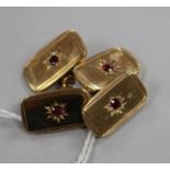 A pair of 9ct gold cufflinks with inset red stone.
