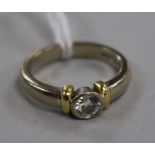 An 18ct gold and collet set solitaire diamond ring, size K.