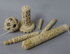 A 19th century Canton carved ivory bodkin case, L 15.5cm, a concentric puzzle ball on stand and four