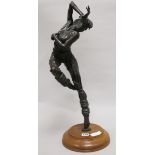 A bronze figure of a ballet dancer, on yew wood socle height 60cm