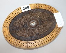 Folk Art. A blonde wood and rolled paper cribbage board