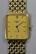 A gentleman's 9ct gold Longines Quartz wrist watch, on a 9ct Longines bracelet, with boxes.