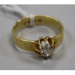 A Victorian 18ct gold and claw set solitaire diamond ring, size Q.