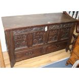 A 17th/18th century carved oak and pine mule chest W.125cm