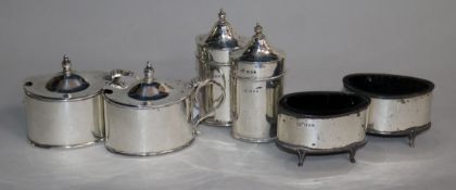 A George V silver six piece condiment set.