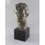 Victor Joseph Ghislain Demanet (1895-1964). A bronze head study of a young man, signed in the