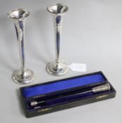 A cased silver mounted conductor's baton and a pair of silver spill vases.