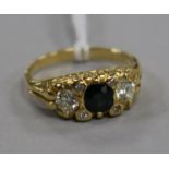 A 1970's 18ct gold, sapphire and diamond three stone ring, size M.