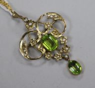 An Edwardian 9ct gold seed pearl and green stone set scroll pendant, on a 9ct gold fine link