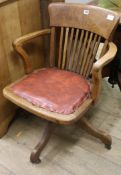 An oak captain's chair