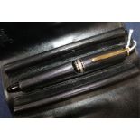 A Montblanc Meisterstuck black 147 Traveller fountain pen with 14K nib and cartridges, in leather