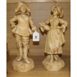 A pair of Continentals porcelain figures, cavalier and a lady tallest 40cm