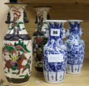 A pair of Chinese 'warriors' crackle glaze vases and a pair of blue and white vases tallest 25cm