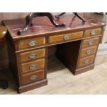 An Edwardian walnut pedestal desk W.122cm