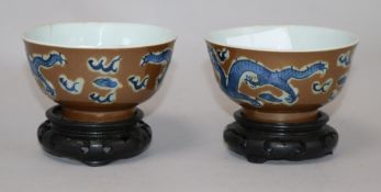 A pair of Chinese cafe au lait glazed 'dragon' bowls Diameter 10.5cm.