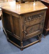 An oak cupboard, in 17th century style W.90cm