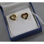 A pair of 18ct gold and diamond set openwork heart shaped ear studs, 10mm.
