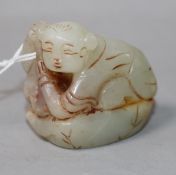 A Chinese jade figure of a crouching boy