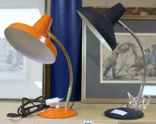 An orange and a black 1960's desk lamp